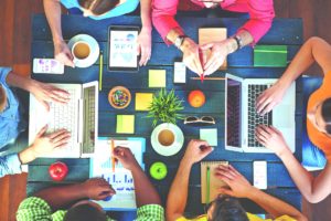 High angle view of people working together at one table